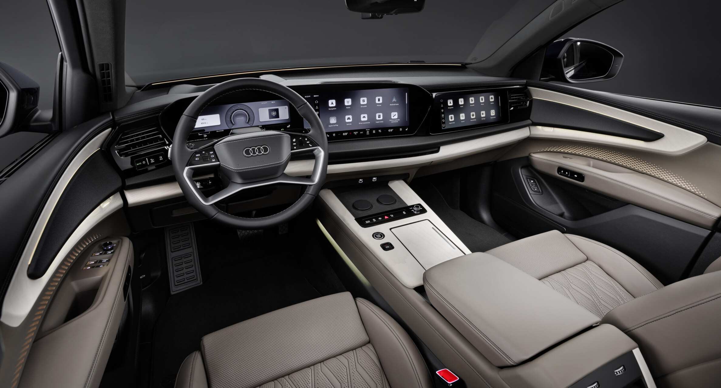 Interior del Audi Q9 con pantallas digitales y asientos de lujo