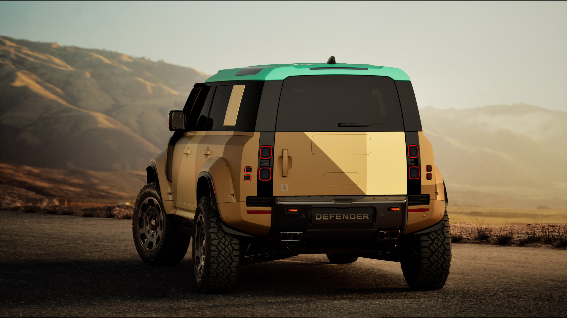 Vista trasera del Land Rover Defender Dakar en un paisaje montañoso
