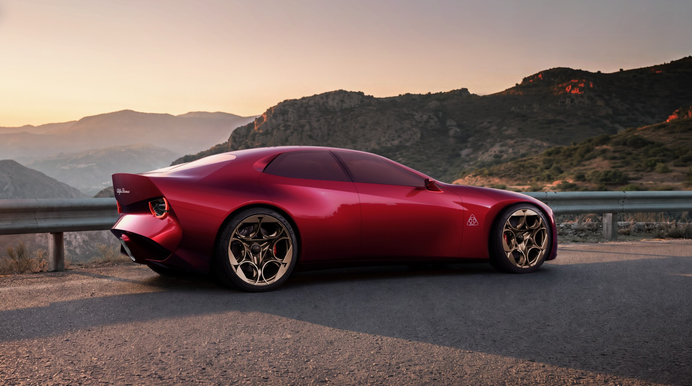 Render fotorrealista del Alfa Romeo Cuorerosso rojo sobre una carretera de montaña