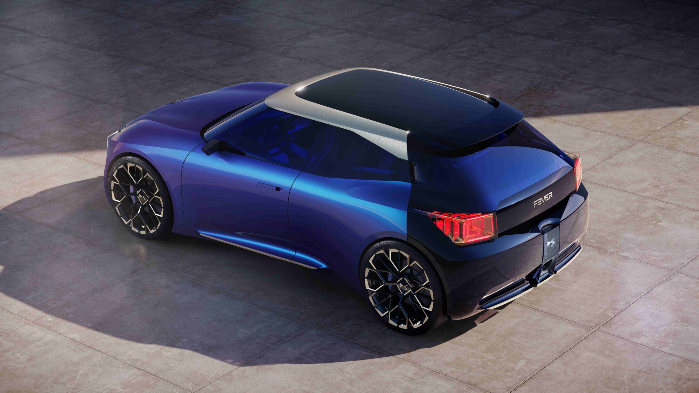 Render de un prototipo azul F3VER visto desde atrás sobre pavimento